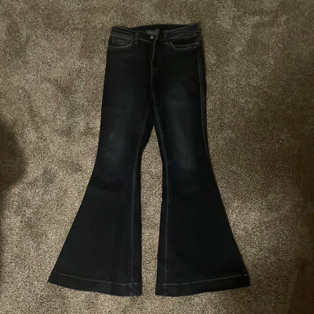 Worn once bell bottom jeans. High waisted. Dark blue wash